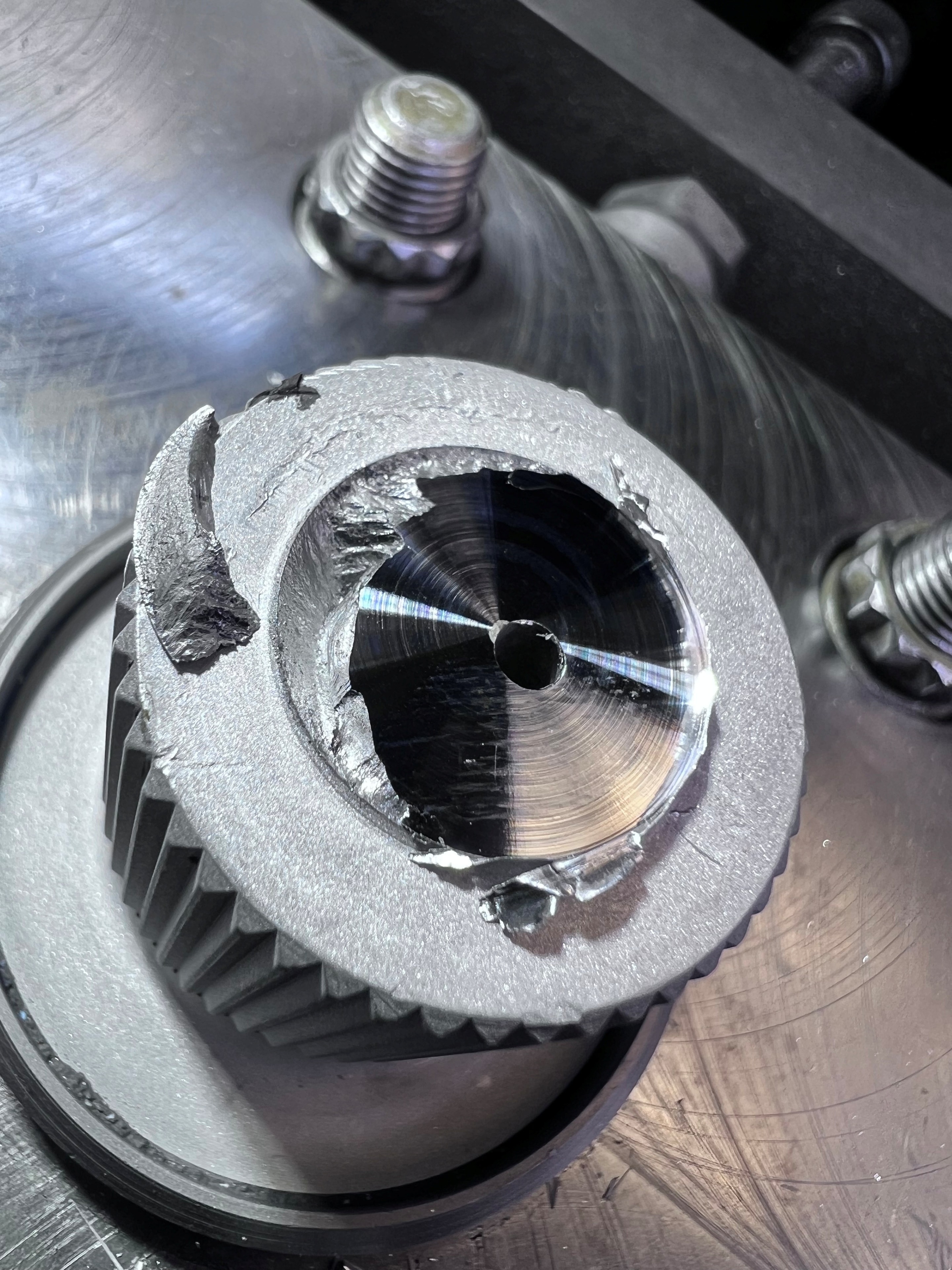 Machined-off TR-182 landing-gear pivot assembly with separated damaged material